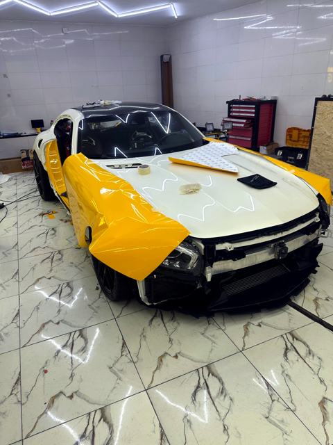 Mercedes-AMG GT, In progress: Yellow film going on the fenders and doors
